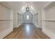 A spacious walk-in closet with plenty of storage shelves and wooden floor at 2555 Chattahoochee Ln, Cumming, GA 30041