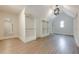 An organized walk-in closet with custom shelving and hardwood floors at 2555 Chattahoochee Ln, Cumming, GA 30041