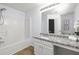 Bathroom with a shower-tub combo and granite countertops at 4457 Watson Ridge Dr, Stone Mountain, GA 30083