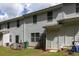 Back exterior of townhome showing siding, windows, doors, patio space, and backyard at 4457 Watson Ridge Dr, Stone Mountain, GA 30083