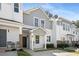 Well-maintained townhome exteriors with covered entrances and grey and white color scheme at 4457 Watson Ridge Dr, Stone Mountain, GA 30083
