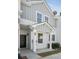 Well-maintained townhome with covered entrance, black front door, and neutral color palette at 4457 Watson Ridge Dr, Stone Mountain, GA 30083