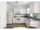 Well-lit kitchen featuring white appliances, granite countertops, and ample cabinet space for storage at 4457 Watson Ridge Dr, Stone Mountain, GA 30083