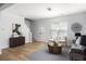 Bright living room featuring modern decor, wood floors, and a neutral color palette at 4457 Watson Ridge Dr, Stone Mountain, GA 30083