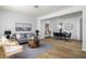 Open-concept living room with a dining area and hardwood floors at 4457 Watson Ridge Dr, Stone Mountain, GA 30083