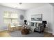 Inviting living room with a modern sofa, chairs, a geometric coffee table, and an area rug at 4457 Watson Ridge Dr, Stone Mountain, GA 30083