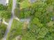 Aerial view of a home with lush green landscaping and mature trees at 4934 Pickys Se Holw, Acworth, GA 30102