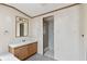 Bathroom featuring a sink, vanity, mirror, towel rack, and a walk-in shower at 4934 Pickys Se Holw, Acworth, GA 30102