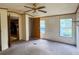 Bedroom with neutral paint, a ceiling fan, two windows and access to other rooms at 4934 Pickys Se Holw, Acworth, GA 30102