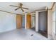 Bright bedroom with a ceiling fan, good closet space, and a view to hallway at 4934 Pickys Se Holw, Acworth, GA 30102
