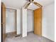 Bedroom featuring a ceiling fan, carpet, and closet space perfect for storage at 4934 Pickys Se Holw, Acworth, GA 30102