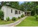 Charming manufactured home with a well-maintained lawn and inviting front porch at 4934 Pickys Se Holw, Acworth, GA 30102