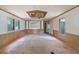 Living room featuring wood-paneled walls, a ceiling fan, and natural light at 4934 Pickys Se Holw, Acworth, GA 30102