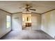 Main bedroom showcases access to main bathroom with a ceiling fan, and a window at 4934 Pickys Se Holw, Acworth, GA 30102