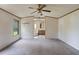 Spacious bedroom featuring an en-suite bathroom and ceiling fan at 4934 Pickys Se Holw, Acworth, GA 30102