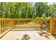 A freshly constructed wood deck overlooks the home's serene backyard at 809 Vinton Wood Rd, Forest Park, GA 30297