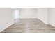 A modern basement with wood-look floors offering a clean and spacious area, with good natural lighting at 809 Vinton Wood Rd, Forest Park, GA 30297