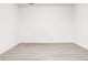 Versatile basement space with modern wood-look floors, offering a bright and open area for various uses at 809 Vinton Wood Rd, Forest Park, GA 30297