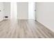 Bright bedroom with modern light wood-look flooring and a neutral palette at 809 Vinton Wood Rd, Forest Park, GA 30297