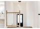Bright foyer featuring staircase, hardwood floors, and modern lighting at 809 Vinton Wood Rd, Forest Park, GA 30297