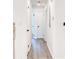 Bright hallway with wood-look floors and white doors at 809 Vinton Wood Rd, Forest Park, GA 30297