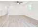 Bright, airy living room with light flooring and a ceiling fan at 809 Vinton Wood Rd, Forest Park, GA 30297