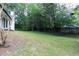 Spacious backyard with mature trees and lush greenery perfect for outdoor activities and relaxation at 823 Laurel Crest Sw Ct, Marietta, GA 30064