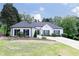 Charming single-story home featuring a beautifully maintained lawn and long driveway at 823 Laurel Crest Sw Ct, Marietta, GA 30064