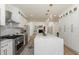 Bright kitchen with stainless steel appliances, white cabinetry, and oversized island perfect for entertaining at 823 Laurel Crest Sw Ct, Marietta, GA 30064