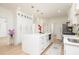 Kitchen with stainless steel appliances, white cabinets and large central island, and hardwood flooring at 823 Laurel Crest Sw Ct, Marietta, GA 30064