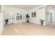 Spacious living room featuring hardwood floors, white walls, and French doors at 823 Laurel Crest Sw Ct, Marietta, GA 30064