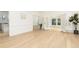 Spacious living room featuring hardwood floors, white walls, and French doors at 823 Laurel Crest Sw Ct, Marietta, GA 30064