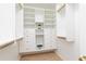Custom walk-in closet with built-in shelving and drawers for optimal organization at 823 Laurel Crest Sw Ct, Marietta, GA 30064