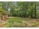 Spacious backyard featuring a well-maintained lawn, mature trees, and privacy for outdoor activities and relaxation at 95 Brandon Ridge Dr, Atlanta, GA 30328