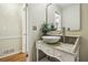 Elegant powder room features a stylish marble vessel sink, granite countertop, and classic white wainscoting at 95 Brandon Ridge Dr, Atlanta, GA 30328