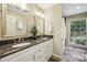 Elegant bathroom with double vanity, granite countertops, and a separate shower area with natural light at 95 Brandon Ridge Dr, Atlanta, GA 30328