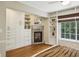 Bedroom featuring custom built-in shelving, closet space, and a cozy fireplace, adding character and functionality to the room at 95 Brandon Ridge Dr, Atlanta, GA 30328