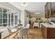 Bright breakfast nook with a large window and seamless flow into the living room and modern kitchen cabinets at 95 Brandon Ridge Dr, Atlanta, GA 30328