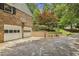 Spacious driveway with brick house, garage, and basketball hoop, offering ample parking at 95 Brandon Ridge Dr, Atlanta, GA 30328