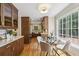 Bright eat-in kitchen featuring modern cabinets, stainless steel appliances, and a sunny breakfast nook with large windows at 95 Brandon Ridge Dr, Atlanta, GA 30328