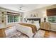 Serene main bedroom featuring built-in shelves, hardwood floors, and ample natural light at 95 Brandon Ridge Dr, Atlanta, GA 30328