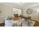 Comfortable office with a large clock, hardwood floors, area rug, and lots of natural light at 95 Brandon Ridge Dr, Atlanta, GA 30328