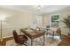Sunlit office space with hardwood floors, neutral walls, decorative rug, and ample natural light from a large window at 95 Brandon Ridge Dr, Atlanta, GA 30328