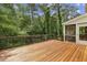 Spacious wooden deck with railing overlooking lush greenery, perfect for outdoor entertaining at 95 Brandon Ridge Dr, Atlanta, GA 30328