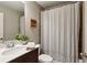 This bathroom features a single sink vanity and a shower/tub with curtain at 1749 Grand Oaks Dr, Woodstock, GA 30188