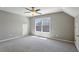 This bonus room features a window letting in natural light and neutral carpeting at 1749 Grand Oaks Dr, Woodstock, GA 30188
