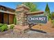 Elegant community sign for Oakhurst by Brock Built nestled in meticulously landscaped grounds at 1749 Grand Oaks Dr, Woodstock, GA 30188