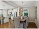 Elegant dining room with hardwood floors, chandelier, and views of the kitchen at 1749 Grand Oaks Dr, Woodstock, GA 30188