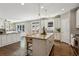 Bright kitchen with granite island, stainless appliances, and an open floor plan for easy entertaining at 1749 Grand Oaks Dr, Woodstock, GA 30188