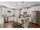 Modern kitchen with white cabinets, stainless steel appliances, granite countertops and island at 1749 Grand Oaks Dr, Woodstock, GA 30188